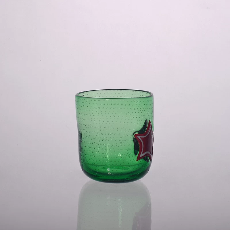 Green color glass candle holder with star