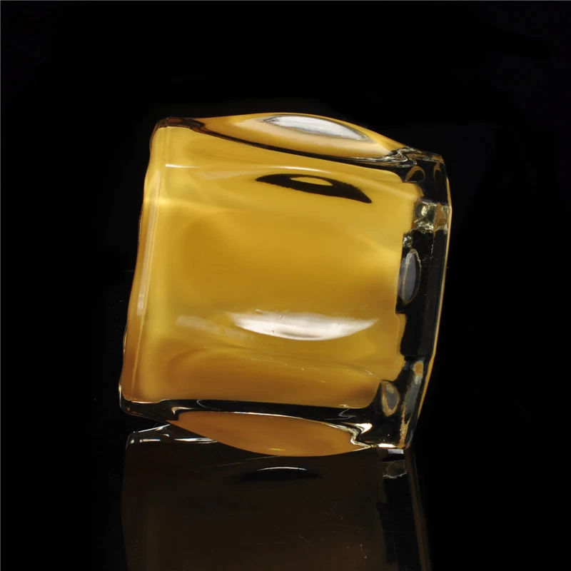 Yellowish clear round votive glass candle holder