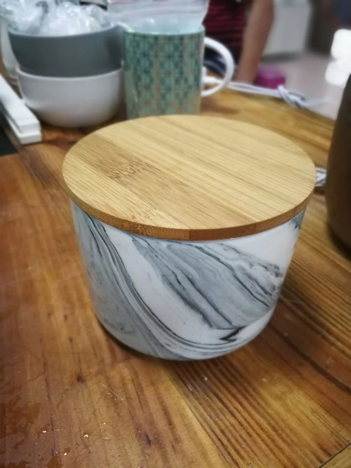 Stock marble effect ceramic candle jar 