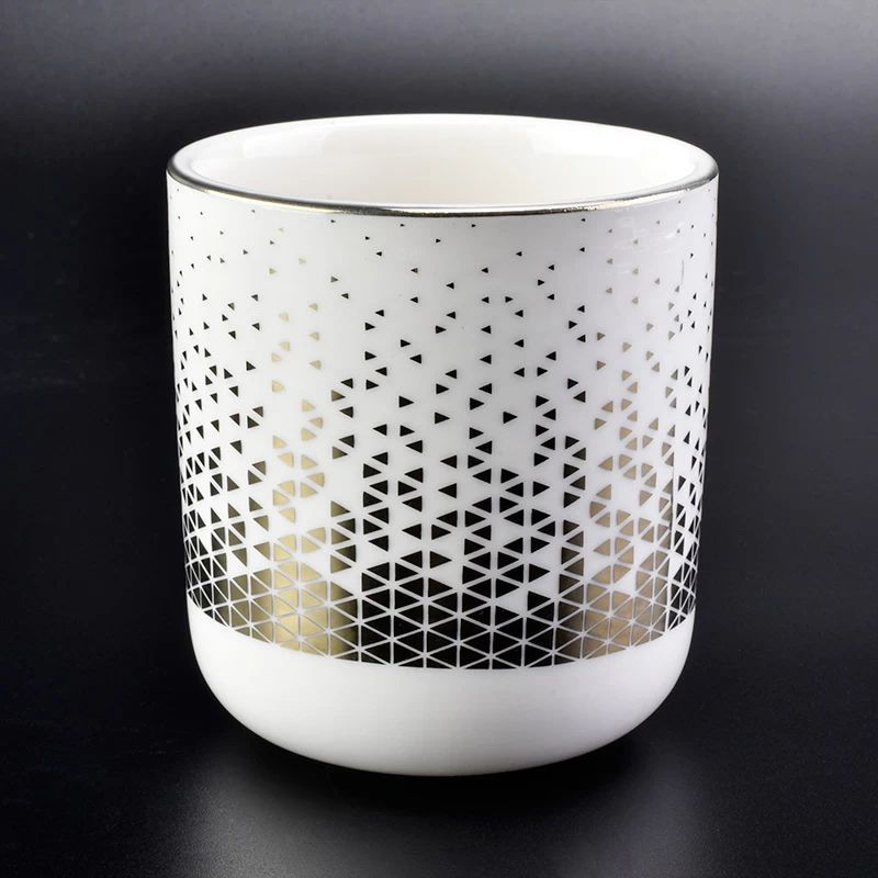 white ceramic candle jar with unique gold pattern