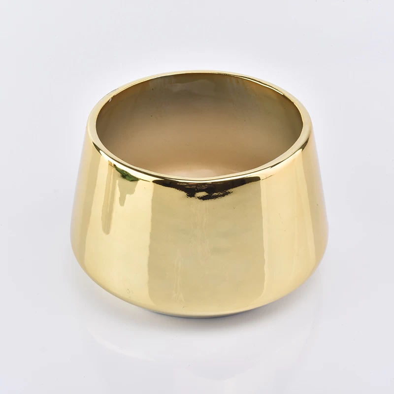 bell shaped shiny gold glazed ceramic candle holder