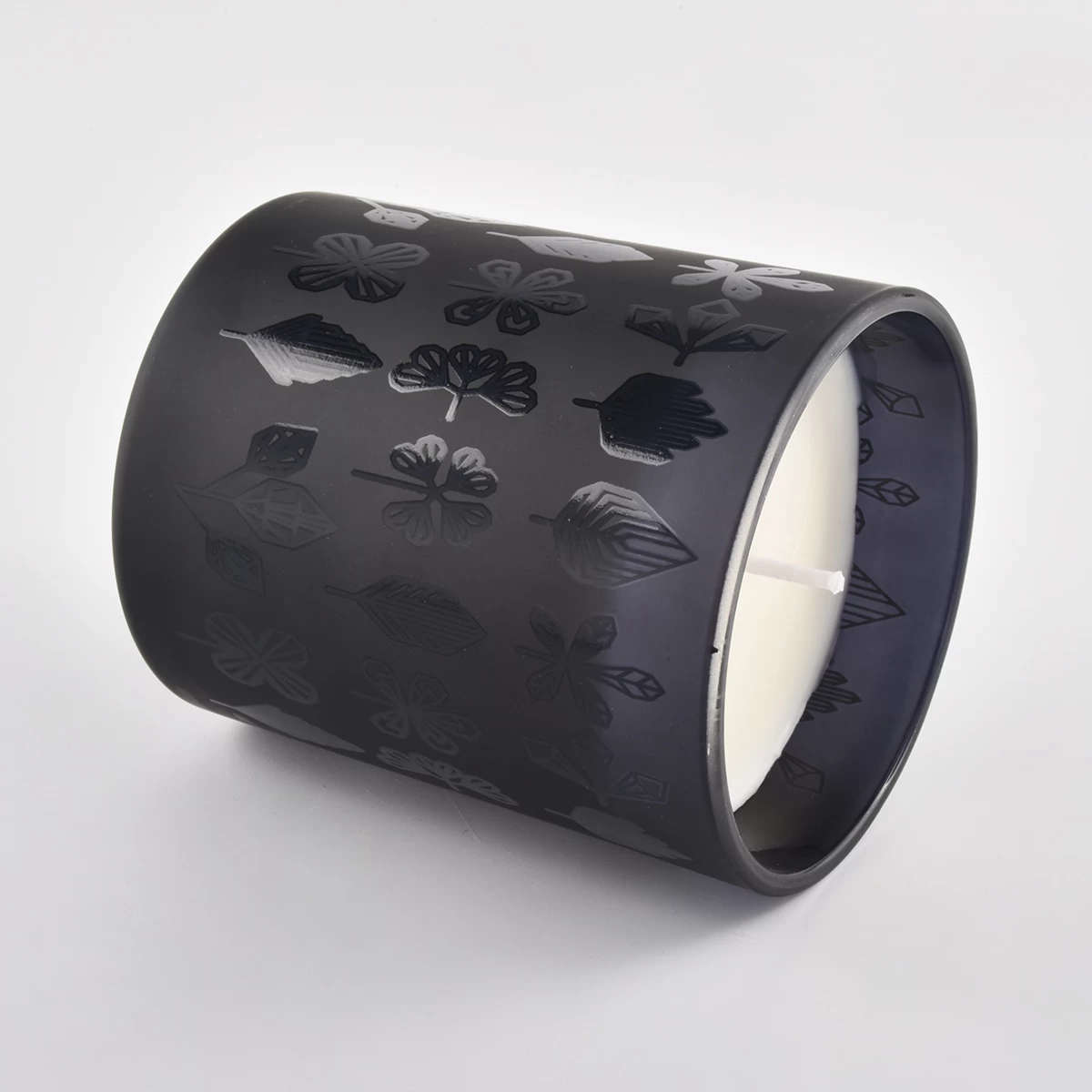 black frosted glass candle jar with embossed patterns