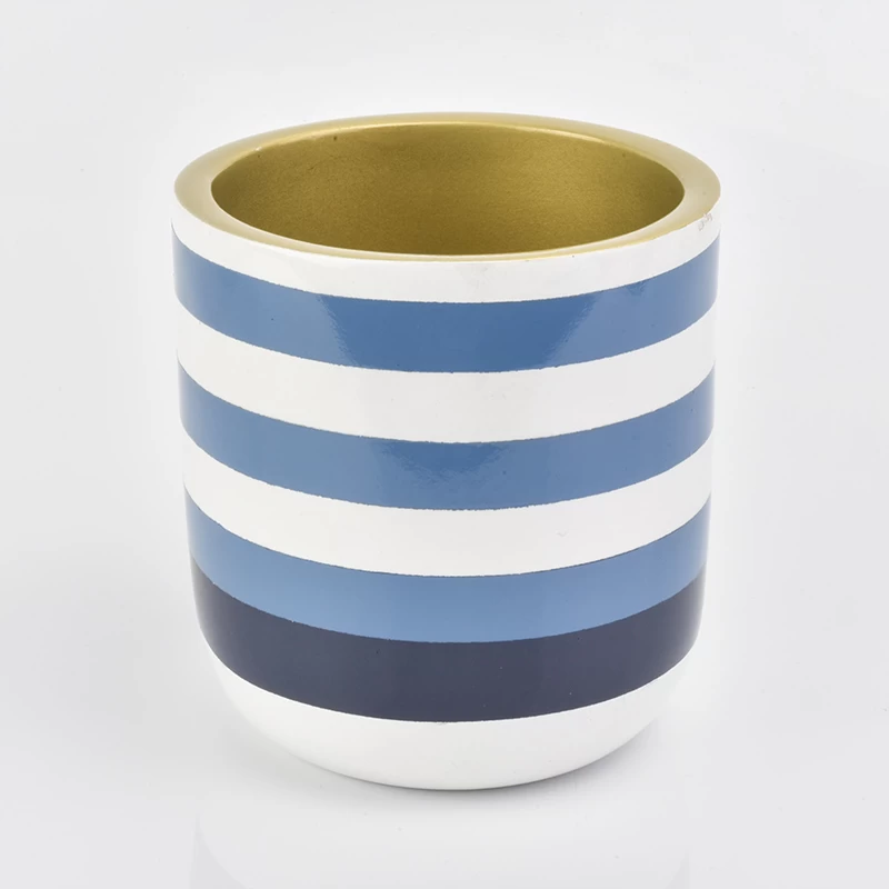 blue and white striped round concrete candle jar