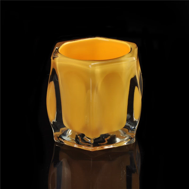 Yellowish clear round votive glass candle holder 