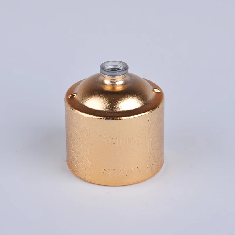 Round shape golden perfume bottle