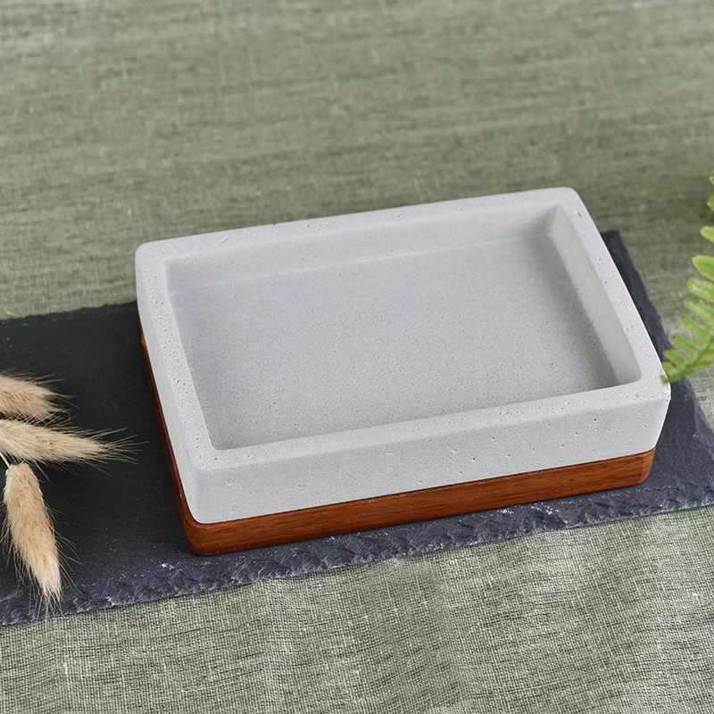 Item Name:Unique square concrete soap dish with wood base Item No.:SGBL17052405 Length: 143mm Width: 94mm Height: 40mm Weight: 578g MOQ:1,000pcs OEM:any custom size can be produced Feature:Unique soap dish,square design soap dish,concrete soap dish with wood base,warm grey soap dish  Sample time: 7-15 days Mass production time:60-65 days after the order confirmed Product capacity: 20000-30000 every month Payment terms: 30% deposit by T/T in advance and the balance after showing the copy of L/T Products type:Unique soap dish,square design soap dish,concrete soap dish,warm grey soap dish with wood base