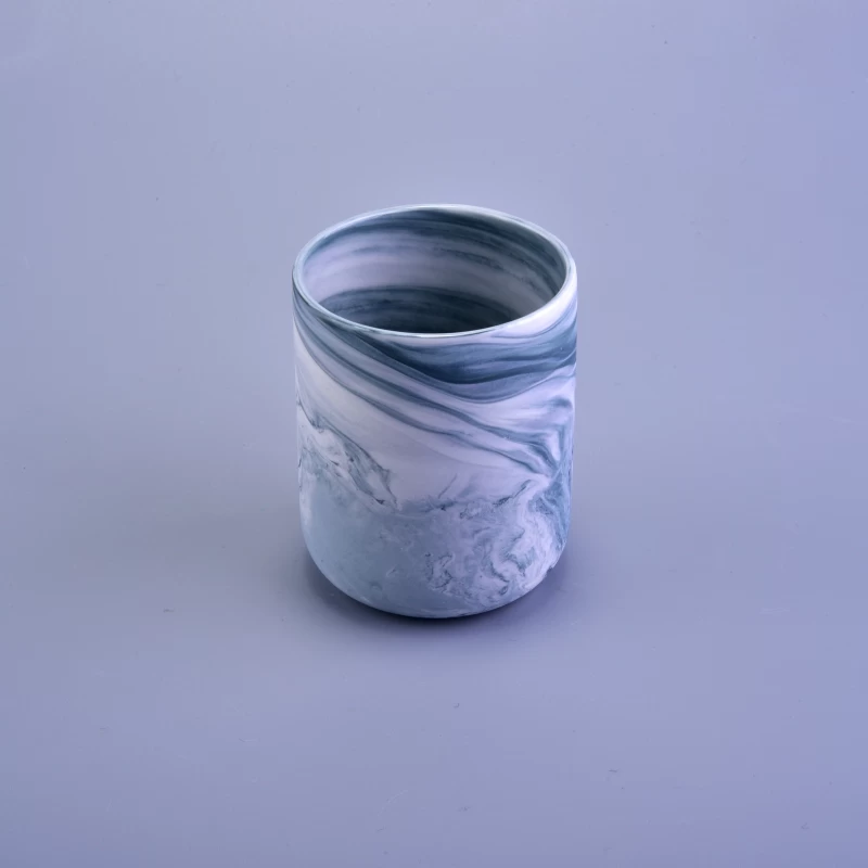 White and blue marbled ceramic candle jar