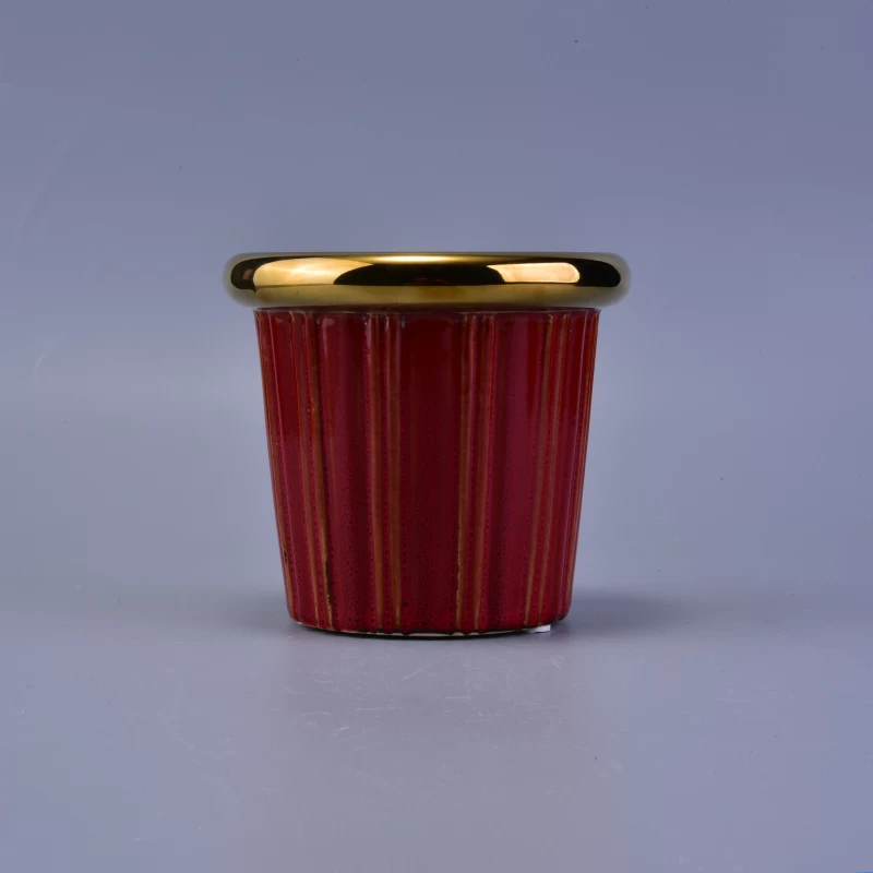 Decorative red glaze ceramic candle jar with golden rim