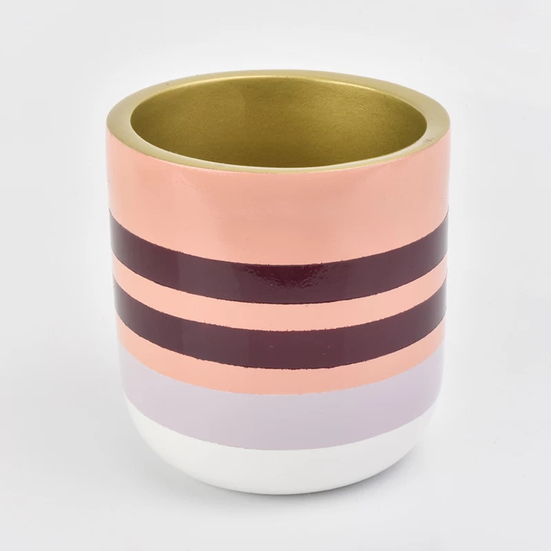 pink line decorated concrete candle container with golden inside
