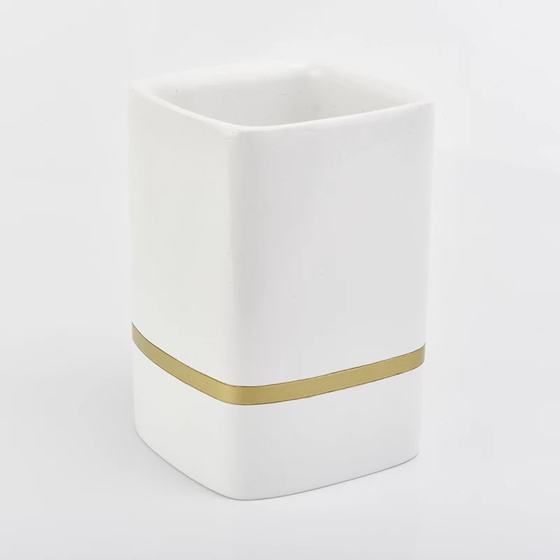 white rectangle concrete candle jars