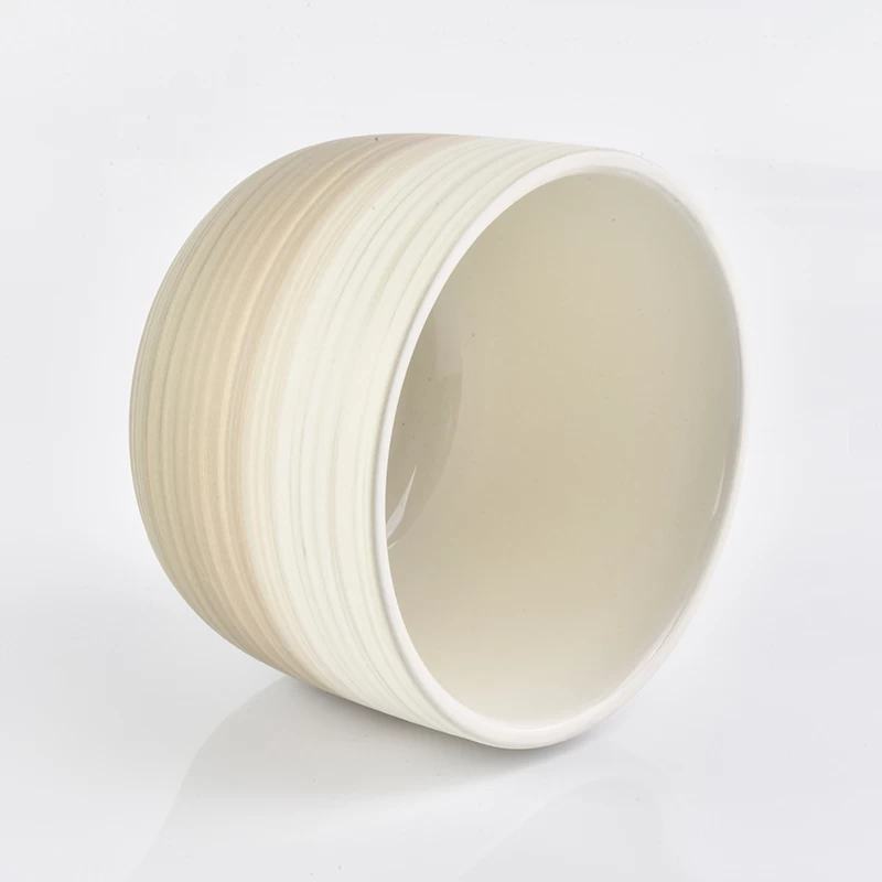 off-white glazed ceramic candle holders with brush pattern