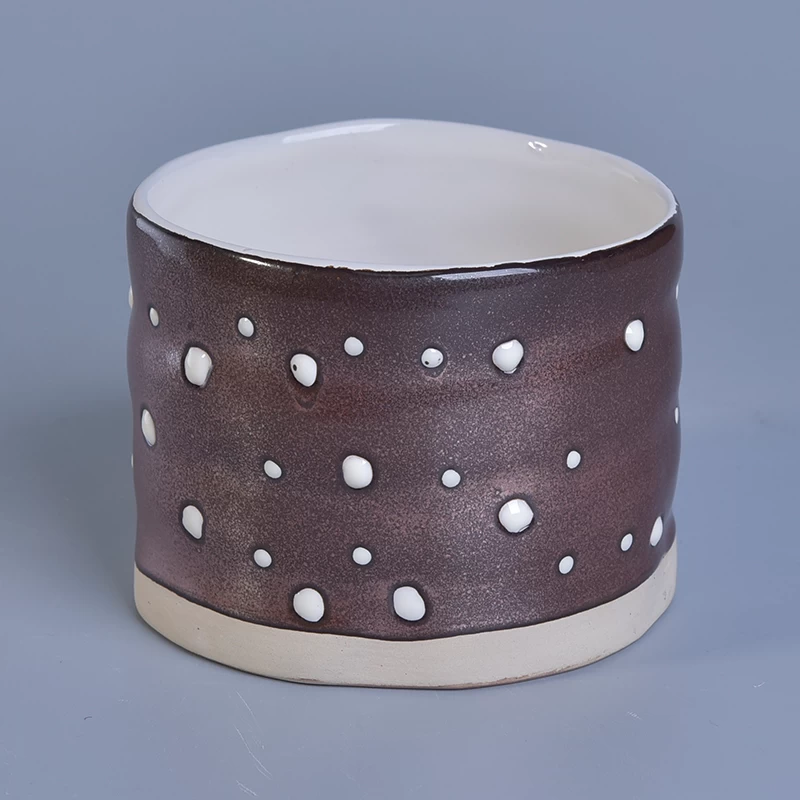 metal glaze ceramic candle jar with hand drawing 