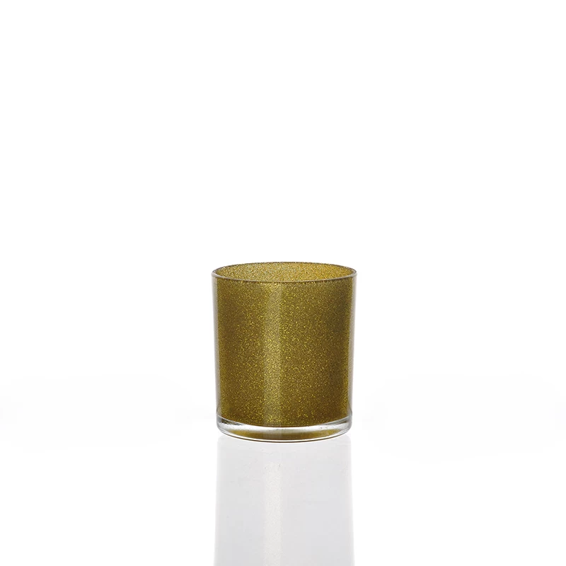 Glass candle holder with golden glitter
