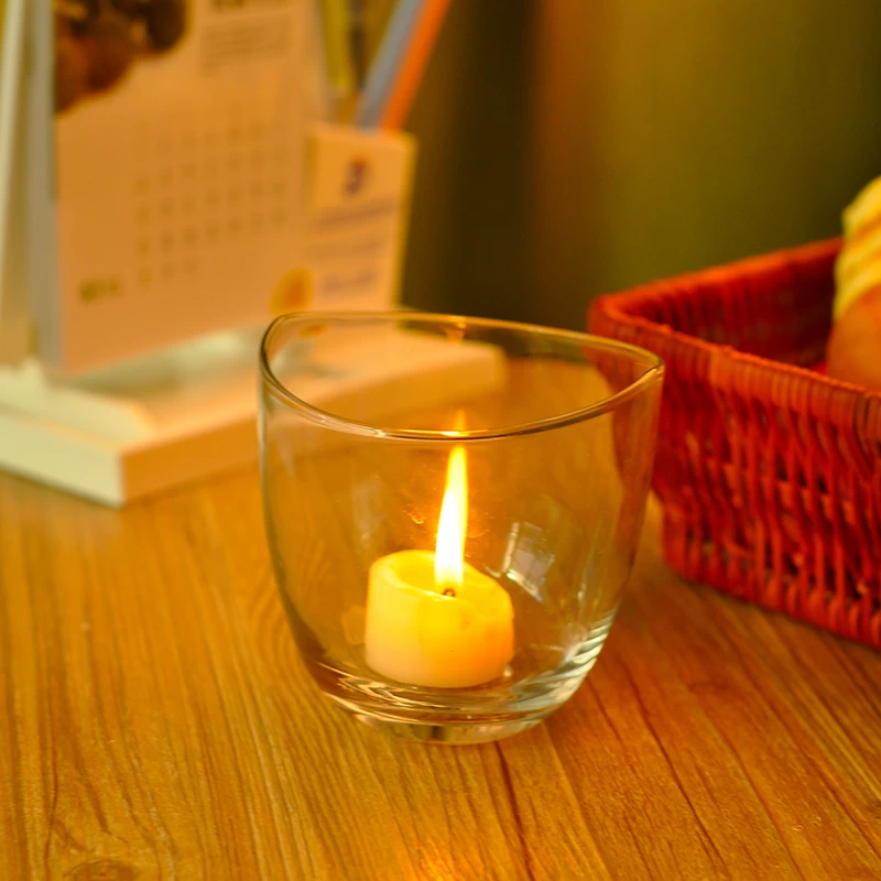 Transparent candle holder with special top