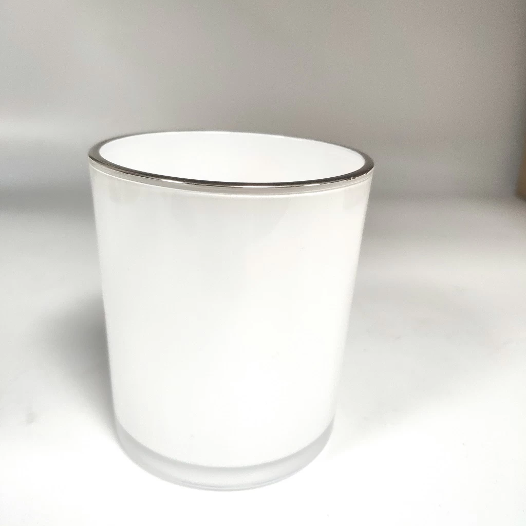 white inside glass candle vessel with gold rim