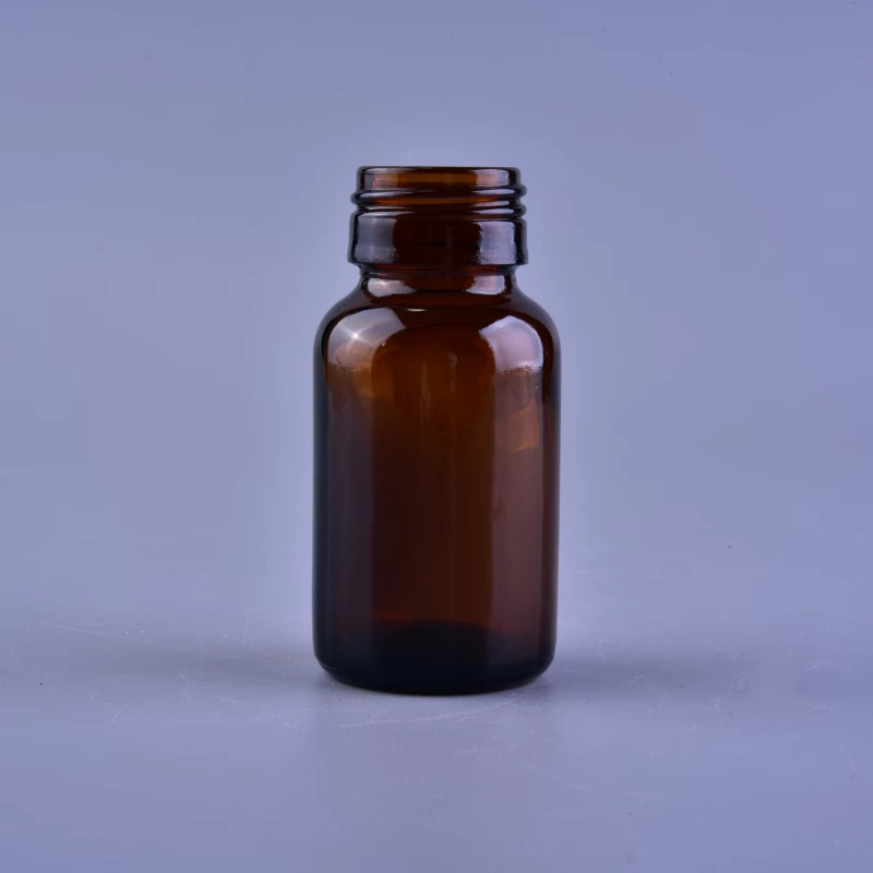 Empty small amber glass medicine bottle