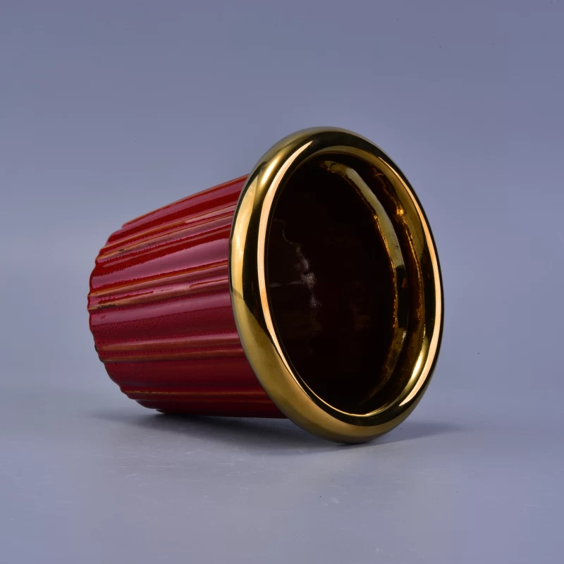 Decorative red glaze ceramic candle jar with golden rim