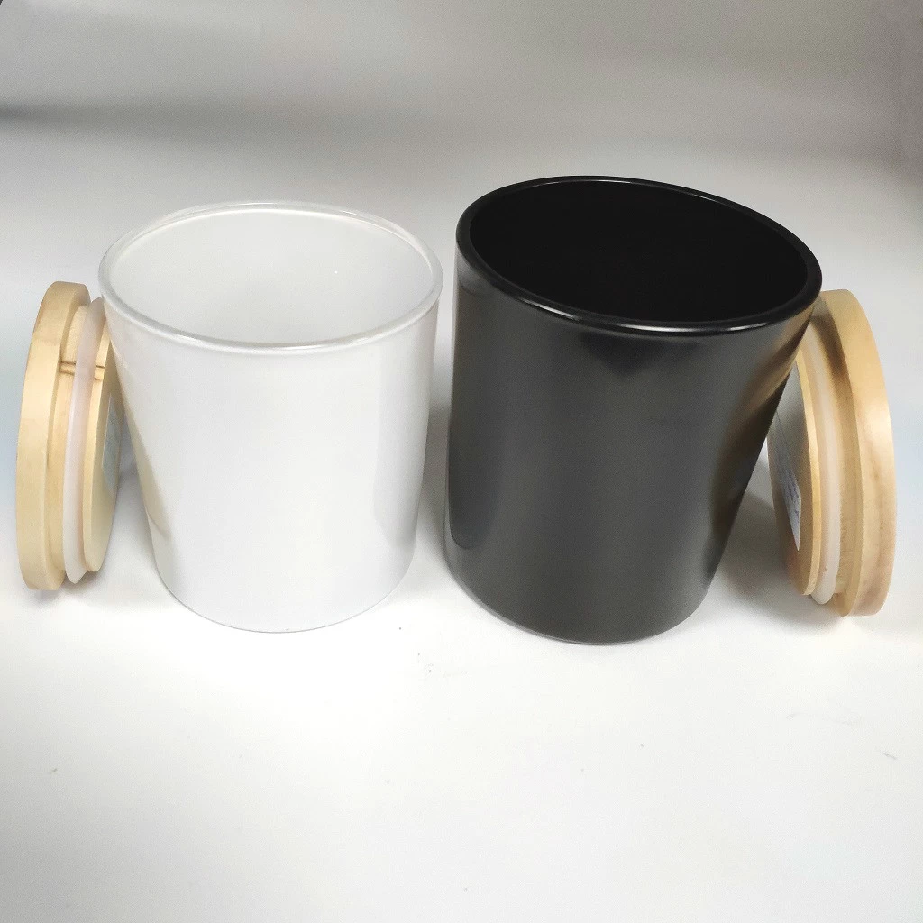white and black glass candle jars with wood lid