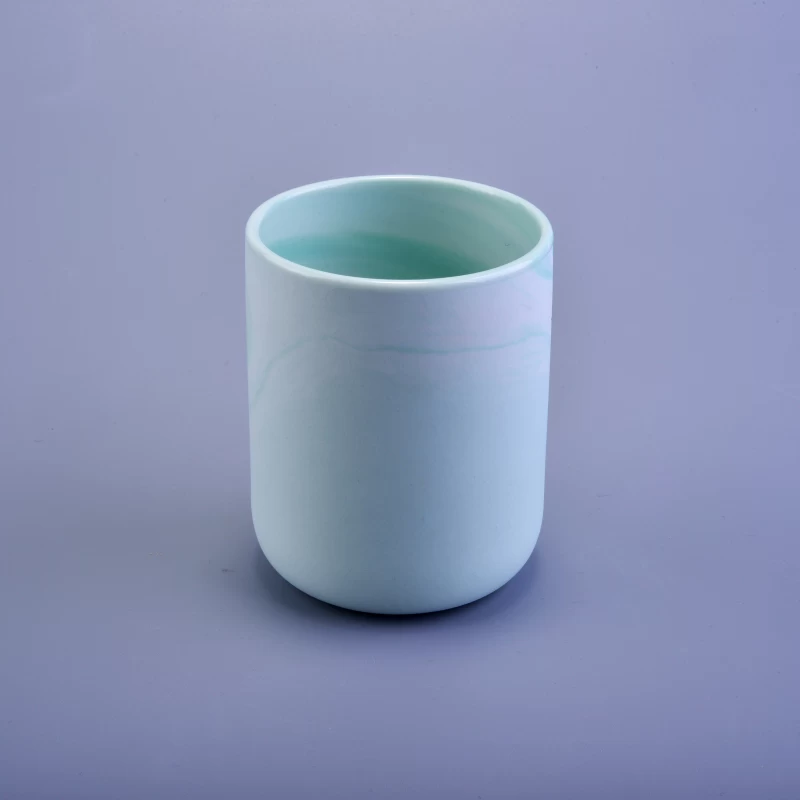 White and blue marbled ceramic candle jar