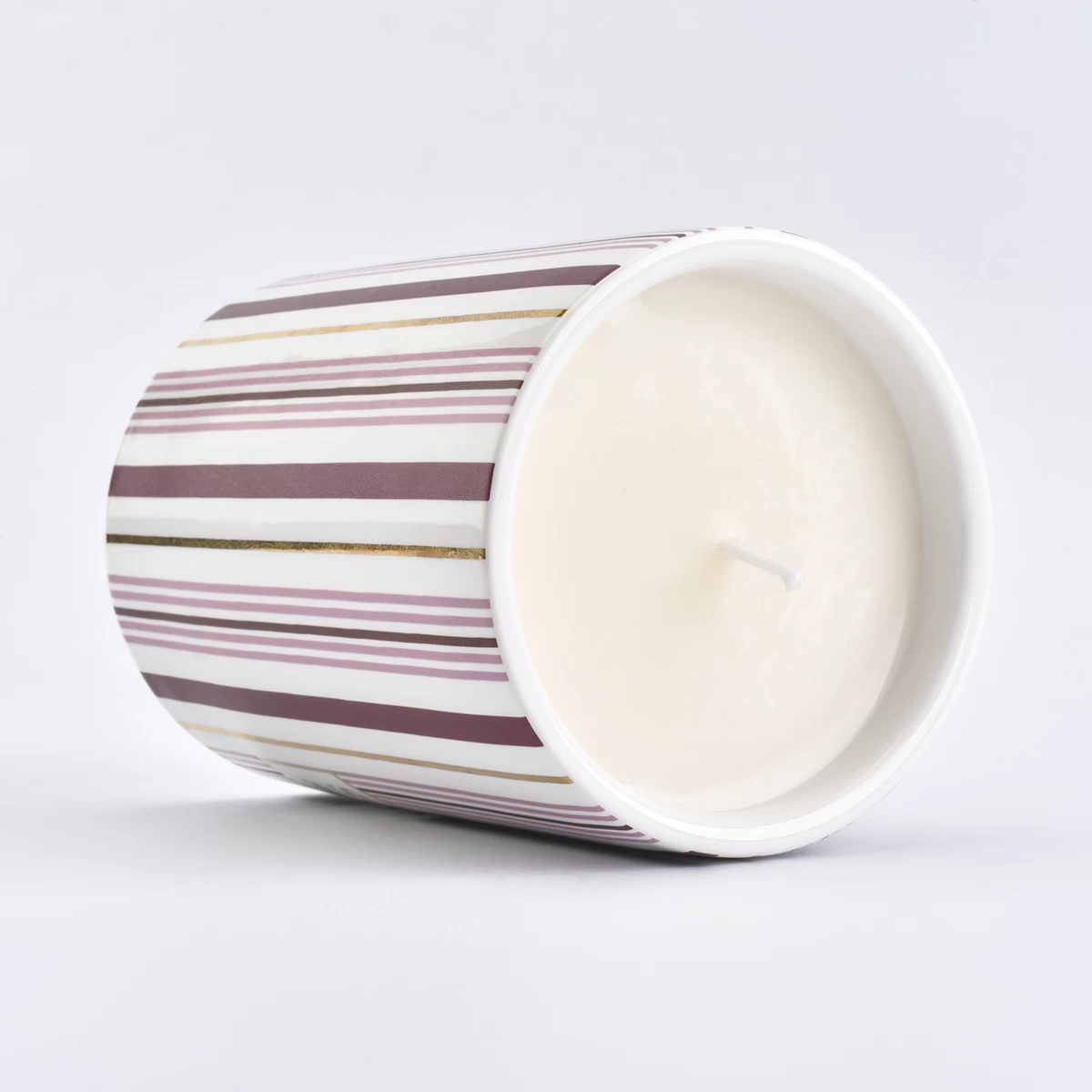 ceramic candle vessel with stripe pattern