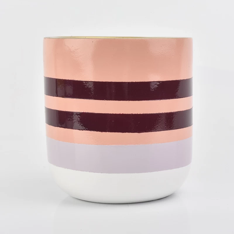 pink line decorated concrete candle container with golden inside