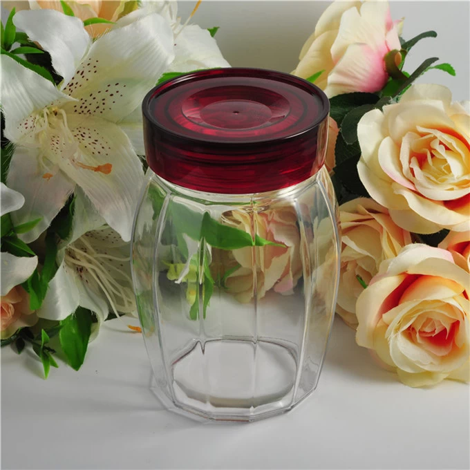 Round glass jar with color lid