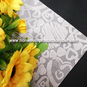 China Light Yellow Heart-shaped Embossing GT-HSLIYE01 PP Spunbond Non Woven Custom Wrapping Paper On Sales manufacturer