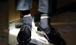 How can men with sweaty feet wear socks healthier?