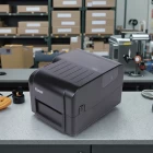 China Alta eficiência de 4 polegadas de desktop Transferência térmica Impressora de etiqueta de código com fita com fita fabricante