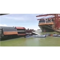 A sudden!  A container barge capsizes at shenzhen terminal, causing several containers to fall into the water.  Multiple shipping companies were involved