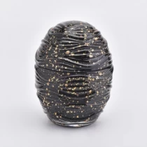China Jarra de vela de vidro em formato de ovo com baixo MOQ e tampas fabricante