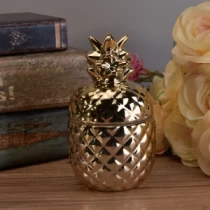 China Popular gold handmade pineapple ceramic candle jar with gold lids manufacturer