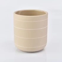 Kína. sveigð botn matt gul keramik kertakrukkur með hvítum línum Framleiðandi