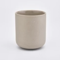 China Pote de vela de cerâmica em formato redondo de amarelo fabricante