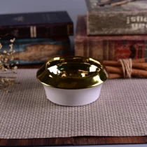 China Handmade gold color ceramic tealight holders with electroplating finish manufacturer