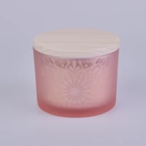 China pink glass candle holder with laser pattern and wooden lid manufacturer