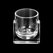 China Wholesale 268ml round bottom glass candle holder with square base with customized decoration manufacturer