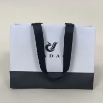 China Yadao CMYK printing paper bag custom logo bag ribbon handle bag gift packaging bag manufacturer