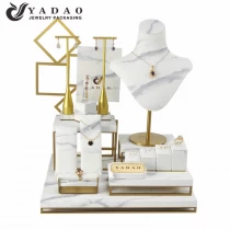 China Custom White High-Gross Gold Brushed Metal with Marbled PU Leather Jewelry Display Stand manufacturer