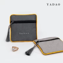 China Zipper tassel design hot selling jewelry coin packaging convenient to carry small satin bag pouch manufacturer