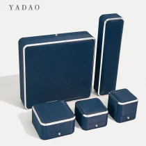 China Fashion style unique design dark blue plastic jewelry ring box set wrapped in pu leather supplier manufacturer