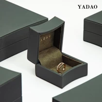 China Luxurious green leather debossed logo ring packaging box arc edge design popular UK jewelry market manufacturer