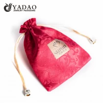 China Cotton red pouch jewelry packaging bag with free customized logo color for jewelry gift packaging manufacturer