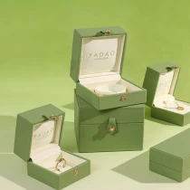 China Spring fresh green color pu leather button design microfiber diamond gemstone jewelry packaging box manufacturer