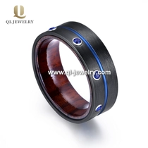 porcelana Increíble banda de boda de madera negra de 8 mm de 8 mm con 7 piedras azules cz anillo de circonio negro China proveedor fabricante