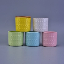 Cina Portacandele in ceramica colorata con motivo floreale inciso con coperchio in legno produttore