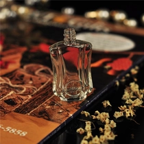 China Mini empty glass container embossed oil perfume bottles supplier manufacturer