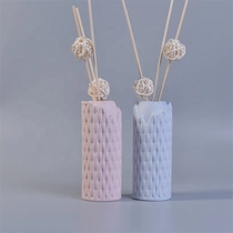 China Fragrance woven pattern ceramic aroma diffuser bottle with reed for home decor supplier manufacturer