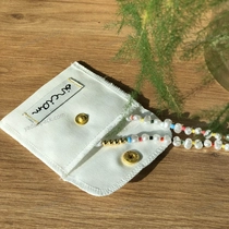 Chine pochette d'emballage de boucles d'oreilles en lin blanc fabricant