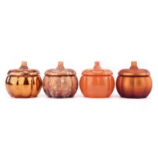 China Wholesale Customized Color Pumpkin Glass Jar with Lids Pumpkin Glass Candy Storage Container manufacturer